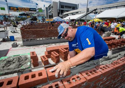 Fred Campbell concentrating on using the right amount of SPEC MIX preblended mortar to win the SPEC MIX BRICKLAYER 500
